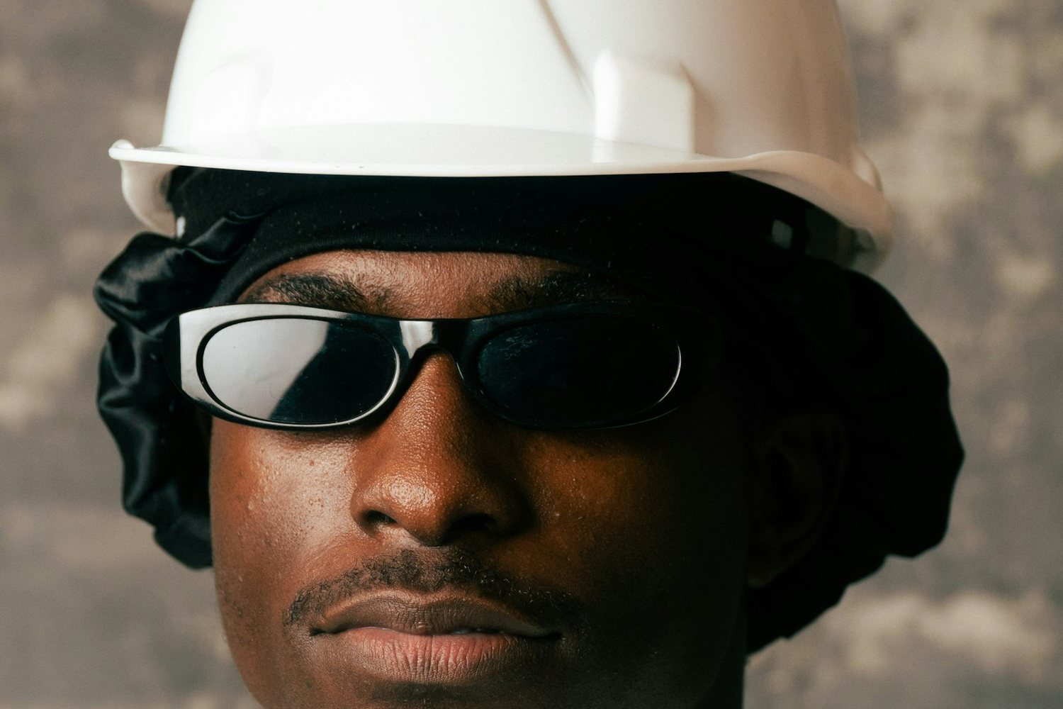 Portrait of a worker in a white hard hat