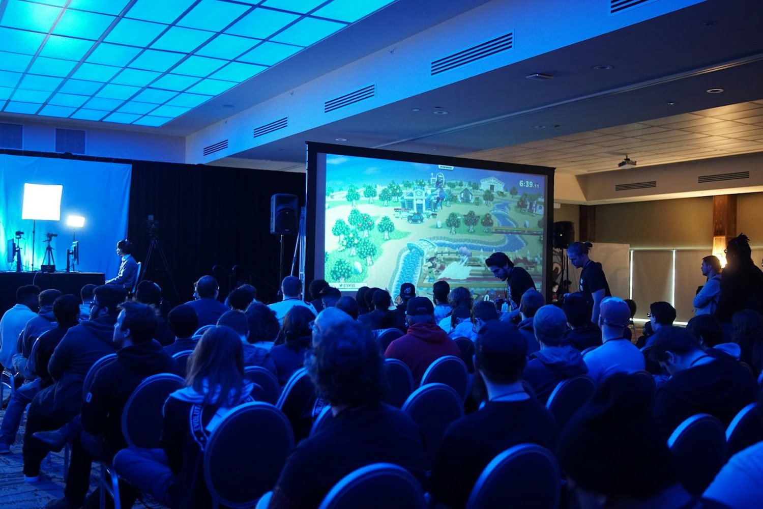 Audience watching a large presentation screen