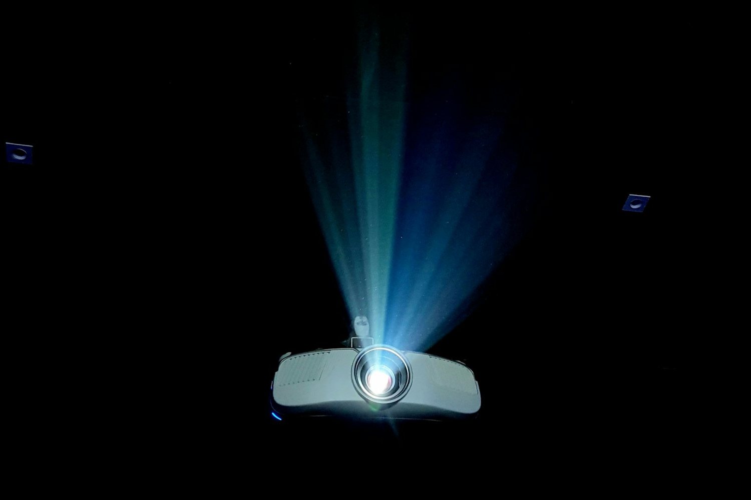 Projector beam cutting through darkness