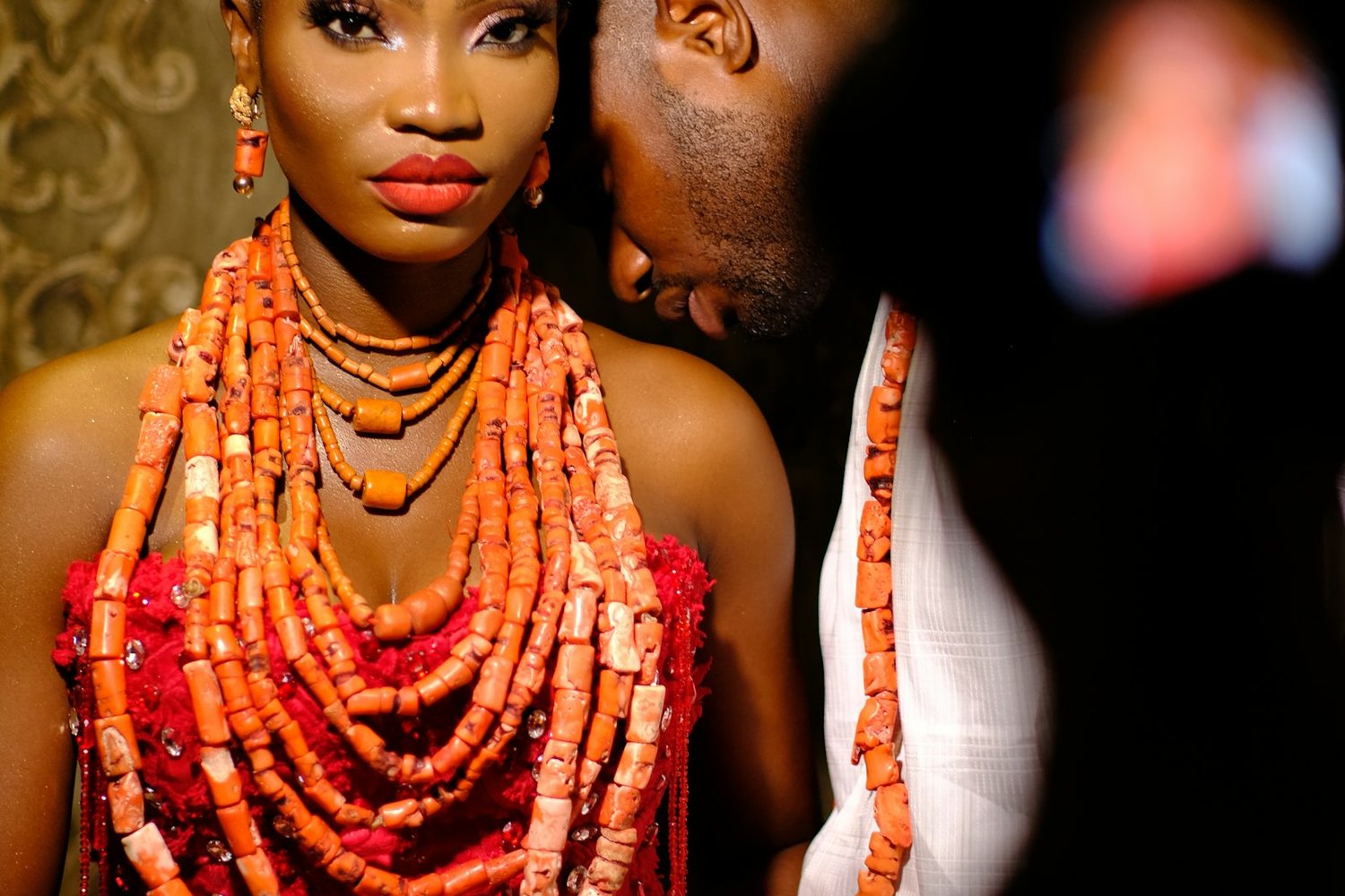Bride wearing traditional coral bead regalia