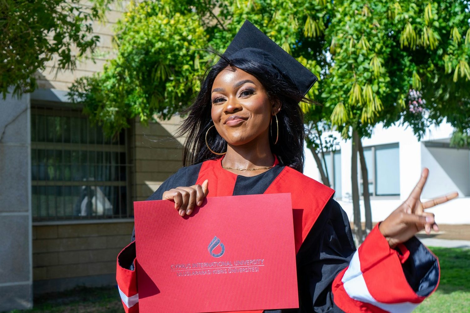 Graduate celebrating with her certificate