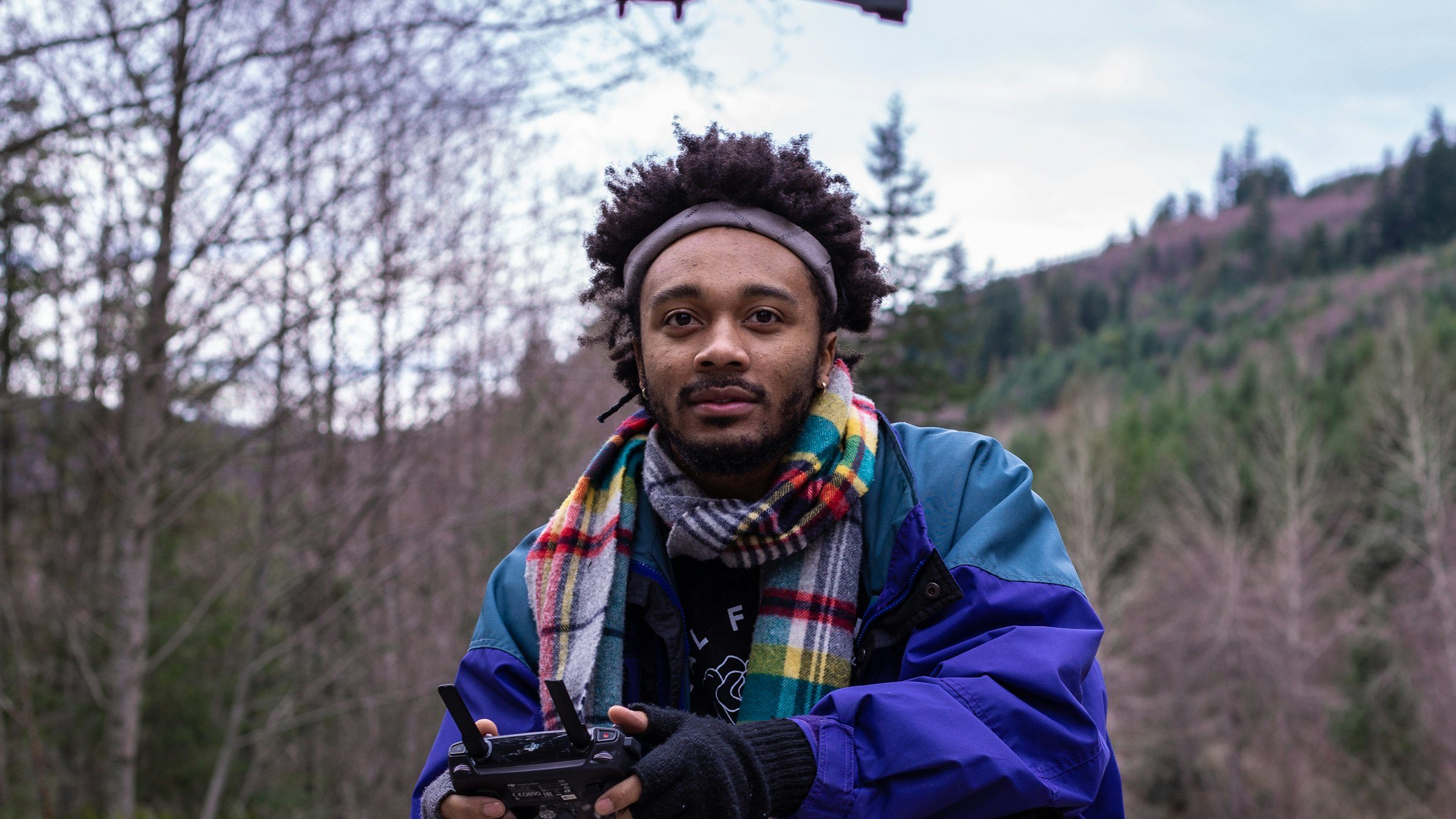 Drone pilot on location with remote controller