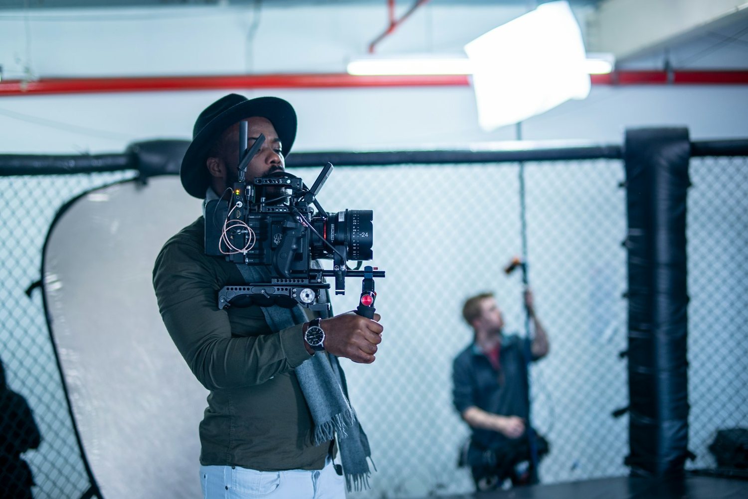Camera operator adjusting a rigged camera