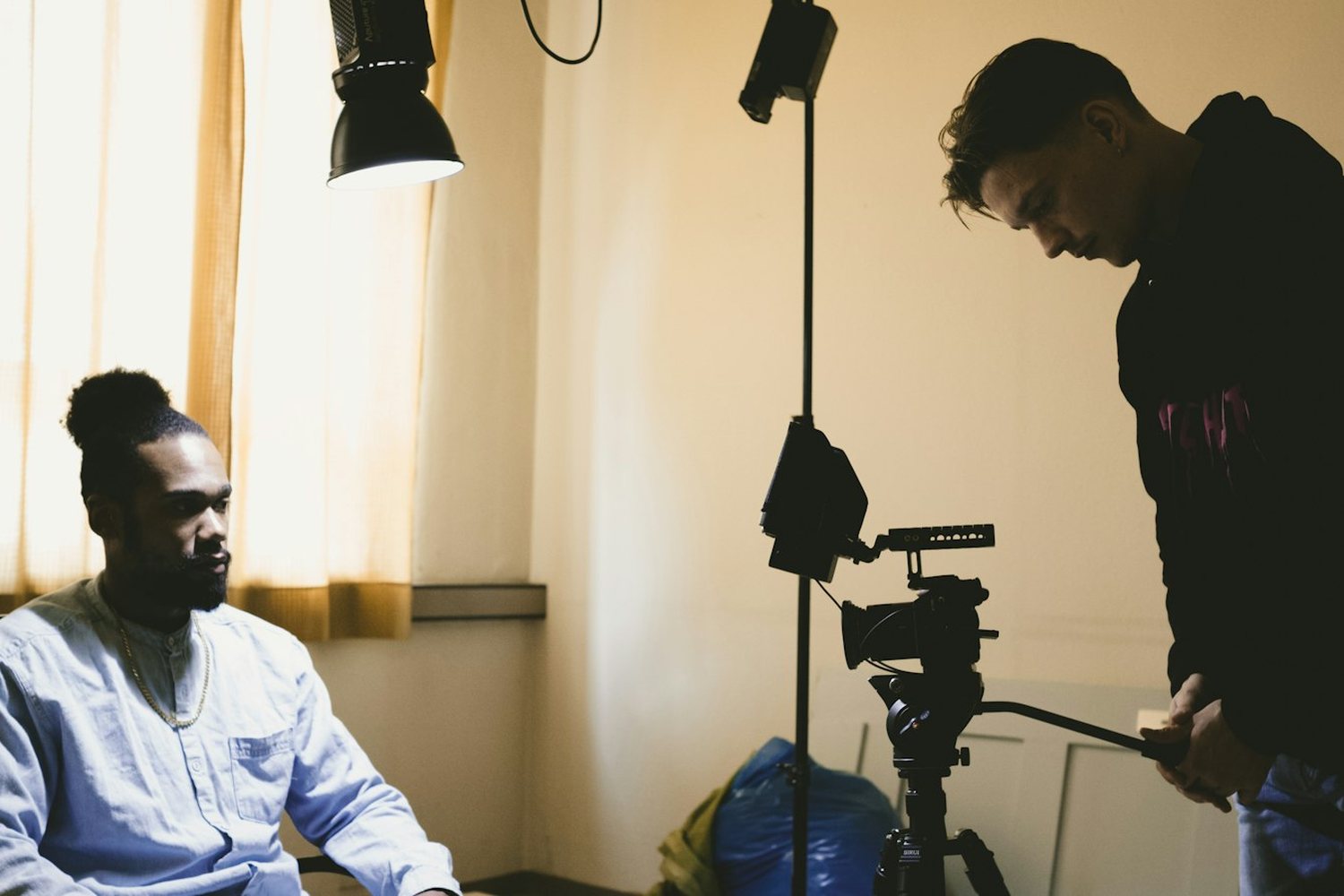 Interview being filmed in a softly lit room