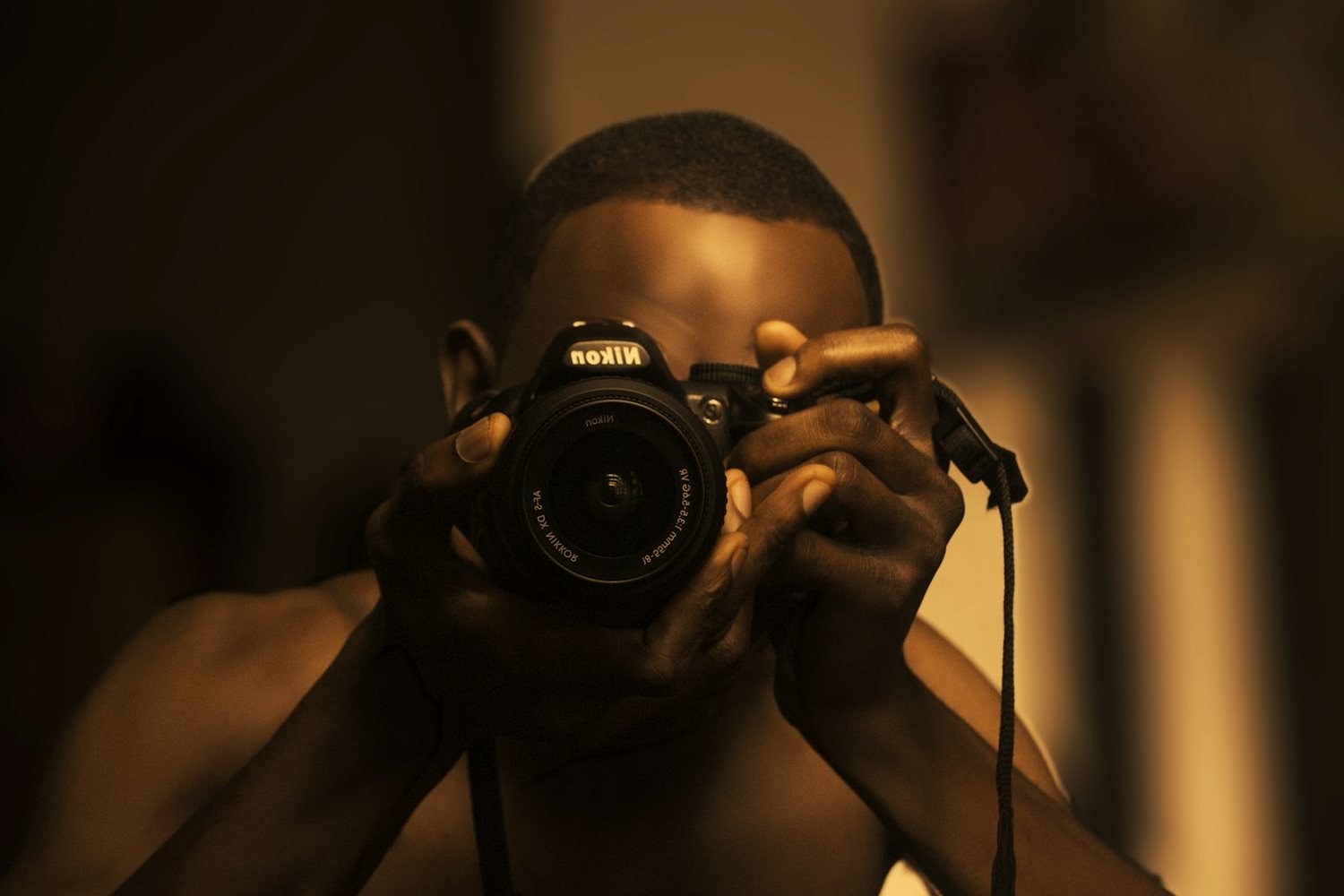 Photographer framing a shot in warm light