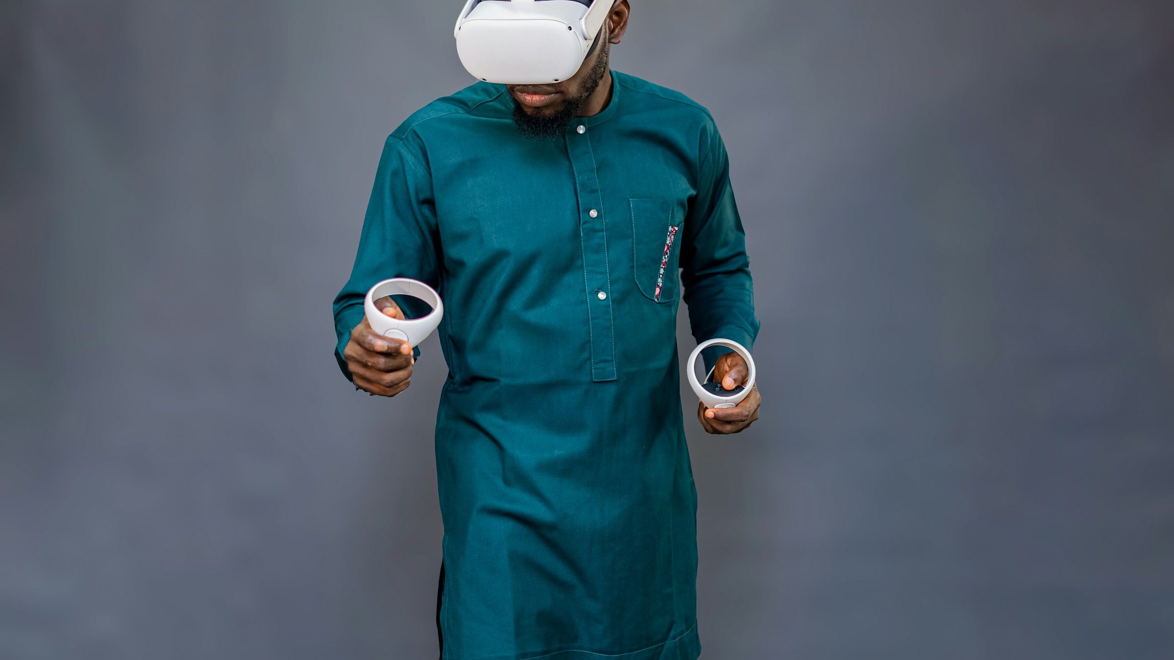 Man in traditional attire wearing a VR headset