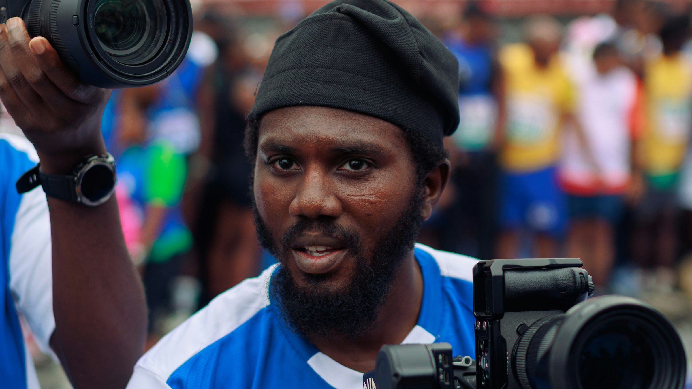 Cameraman filming in a crowd