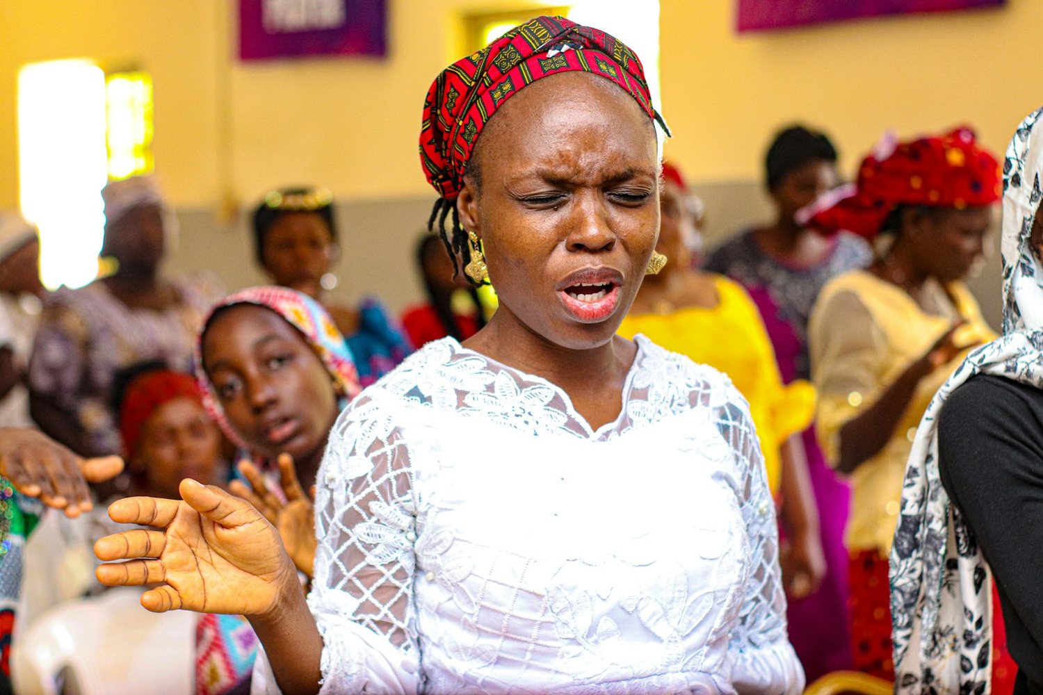 Women singing at a church programme